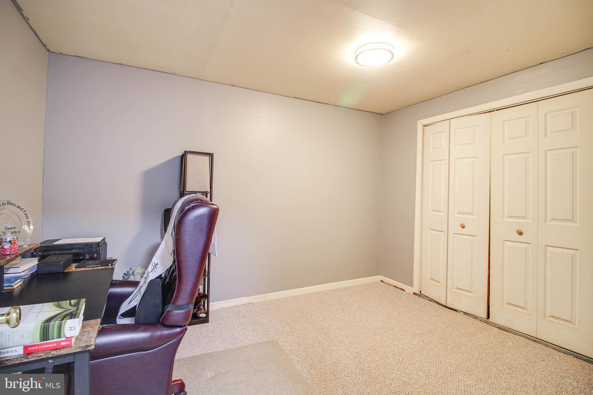 1408 Olmstead Street Curtis Bay, MD 21226 - Photo 25 of 40 a view of room with furniture and gym equipment