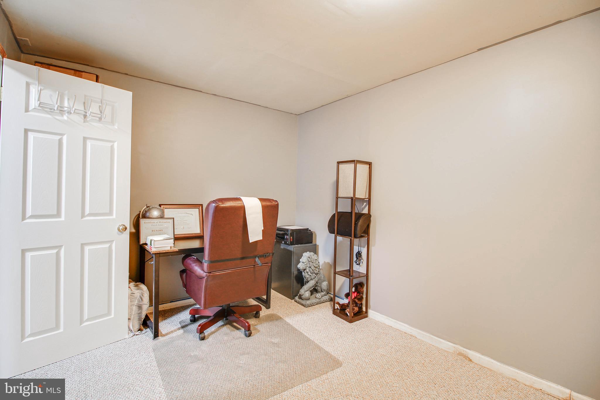 1408 Olmstead Street Curtis Bay, MD 21226 - Photo 26 of 40 a view of a workspace with furniture and a window