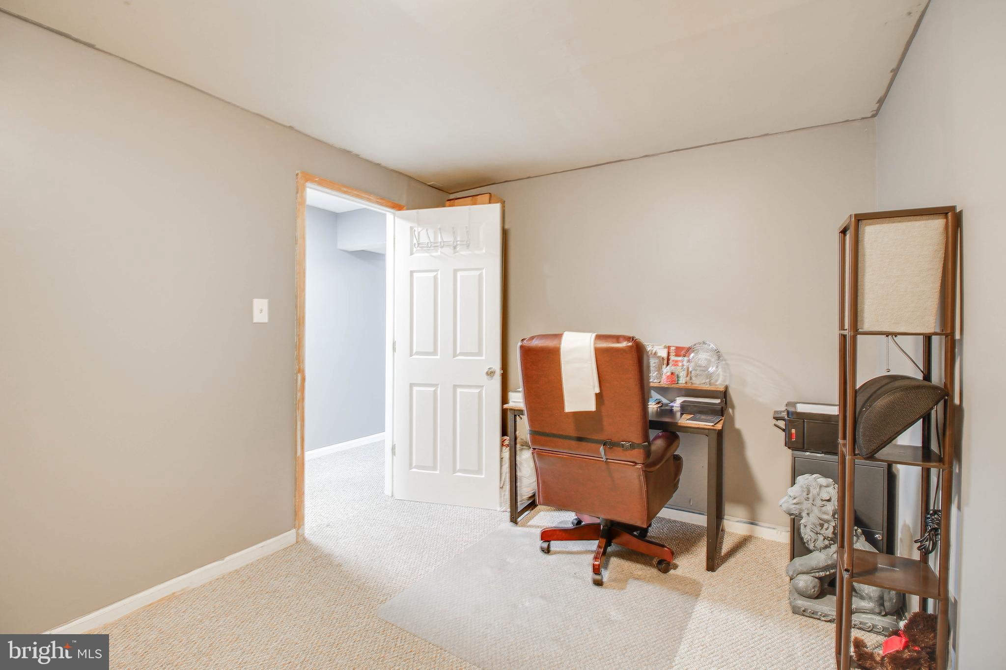 1408 Olmstead Street Curtis Bay, MD 21226 - Photo 27 of 40 a view of a workspace with furniture and a window