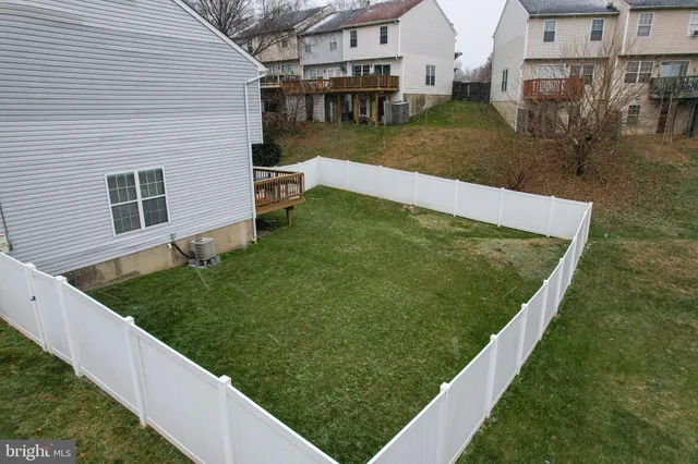 a view of a back yard of the house