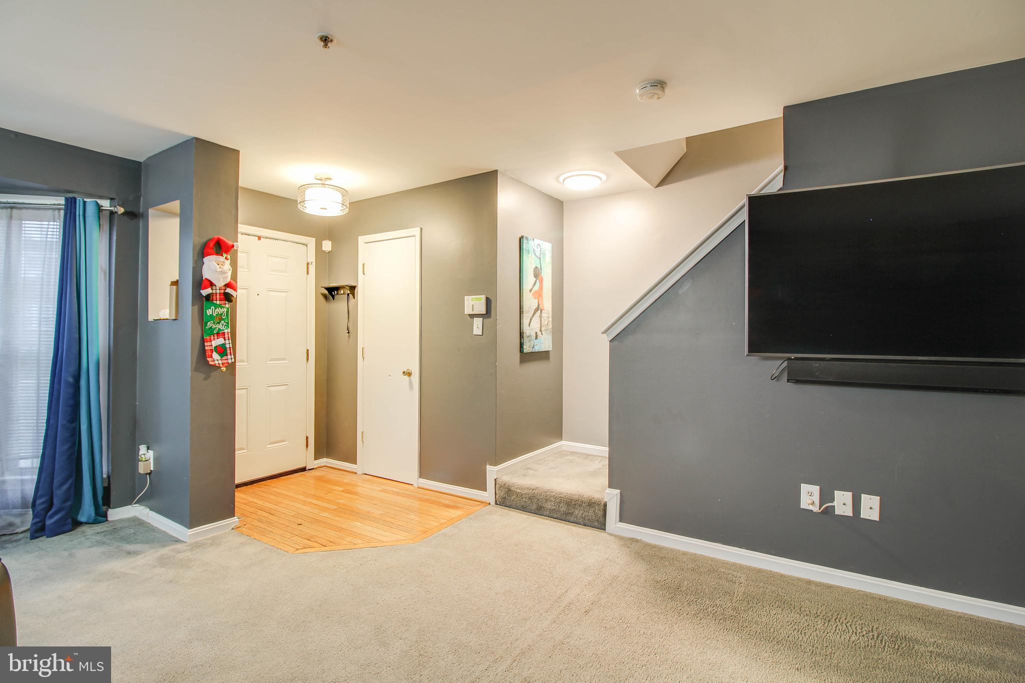 1408 Olmstead Street Curtis Bay, MD 21226 - Photo 4 of 40 a bedroom with a bed and a flat screen tv