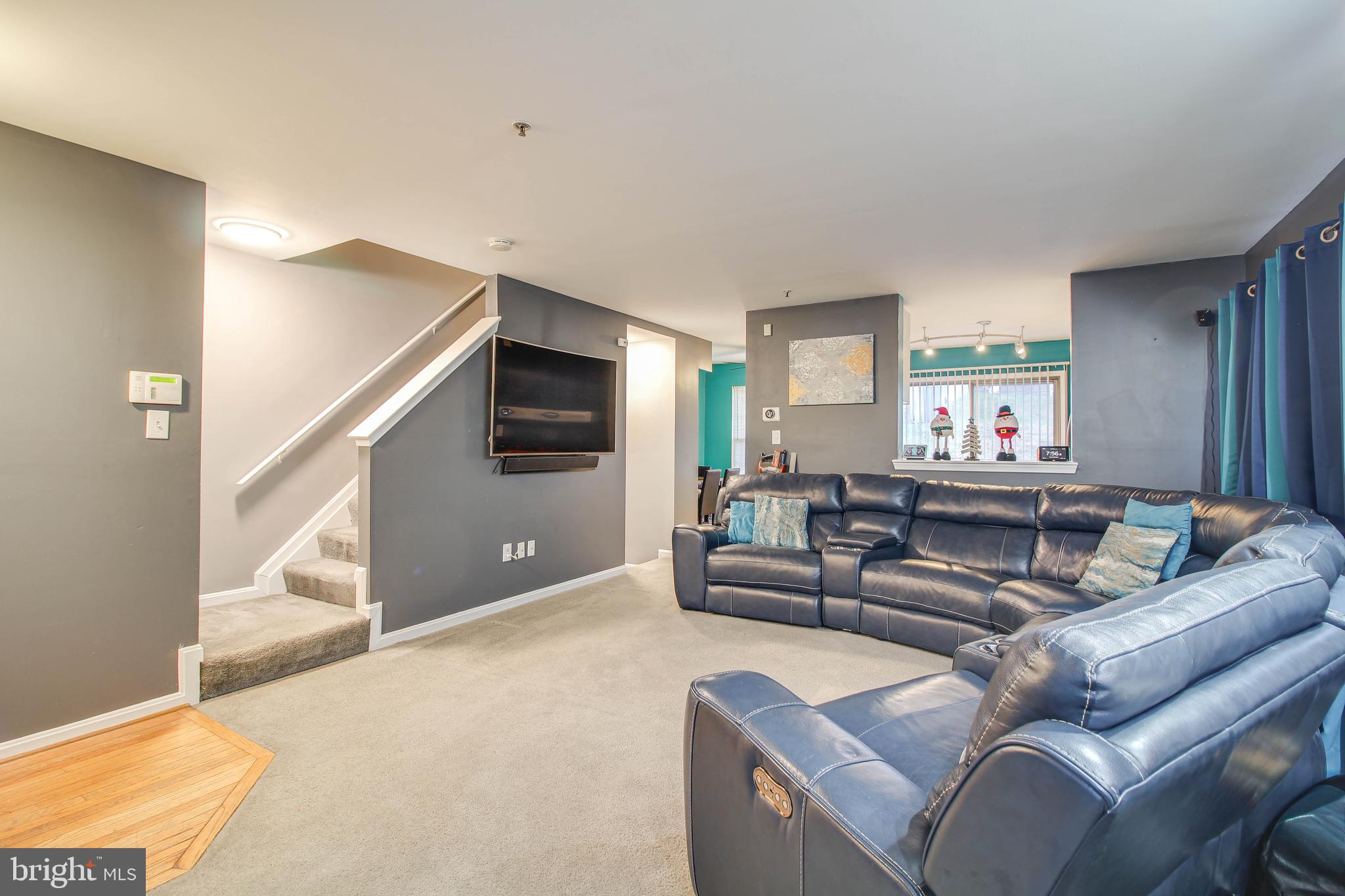 1408 Olmstead Street Curtis Bay, MD 21226 - Photo 5 of 40 a living room with furniture and a flat screen tv