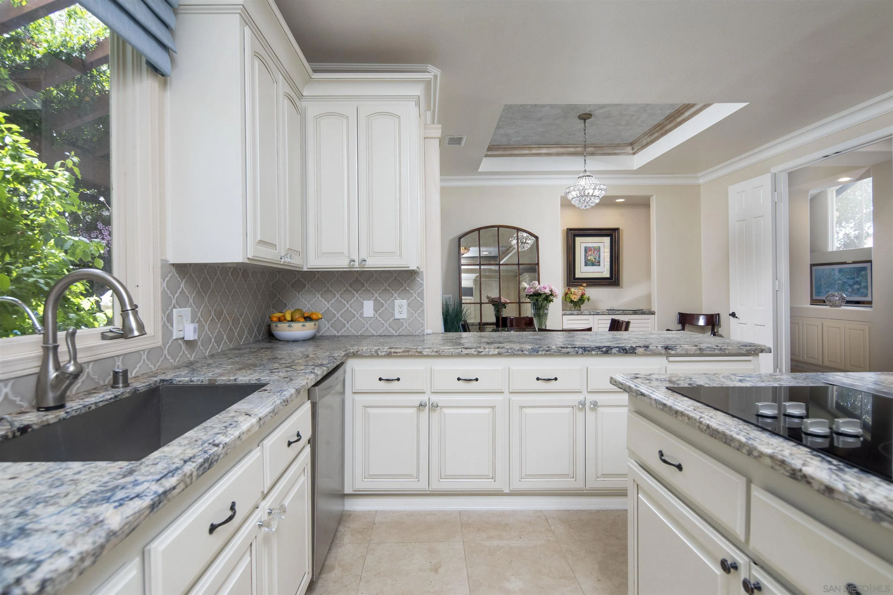 15448 Pimlico Corte Rancho Santa Fe, CA 92067 - Photo 18 of 31 a kitchen with granite countertop white cabinets and white appliances