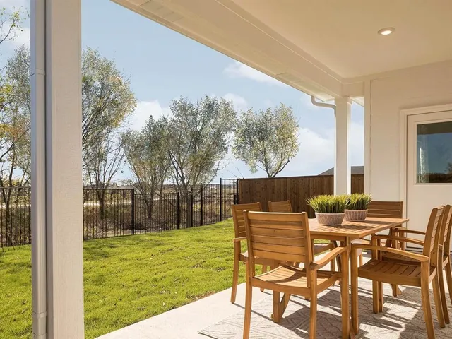 a view of an chairs and tables in the patio