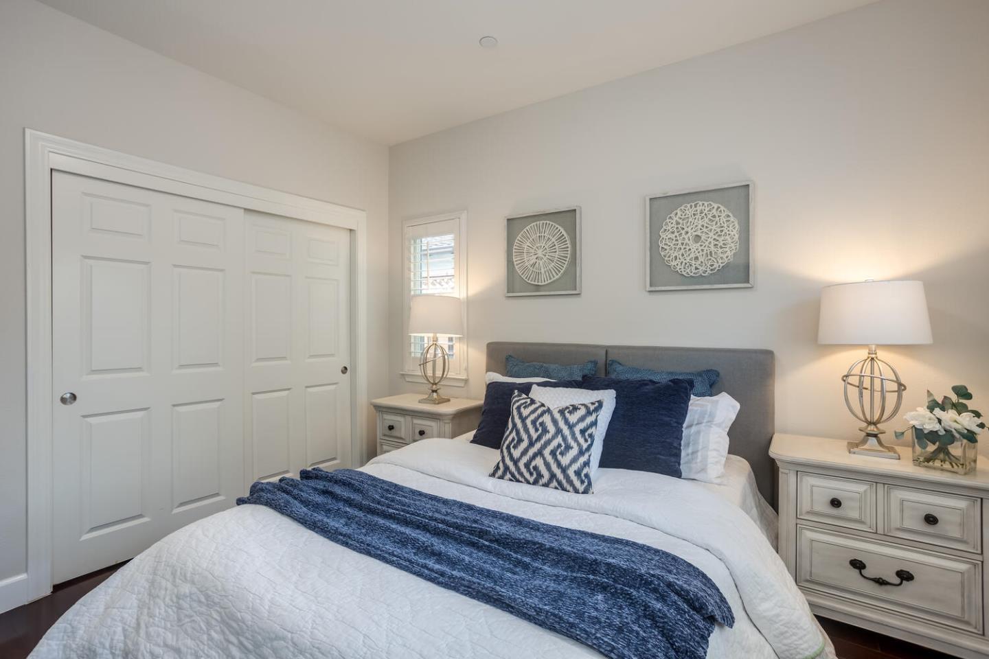 563 Alberta Avenue Sunnyvale, CA 94087 - Photo 12 of 32 a bedroom with a bed and lamp on dresser