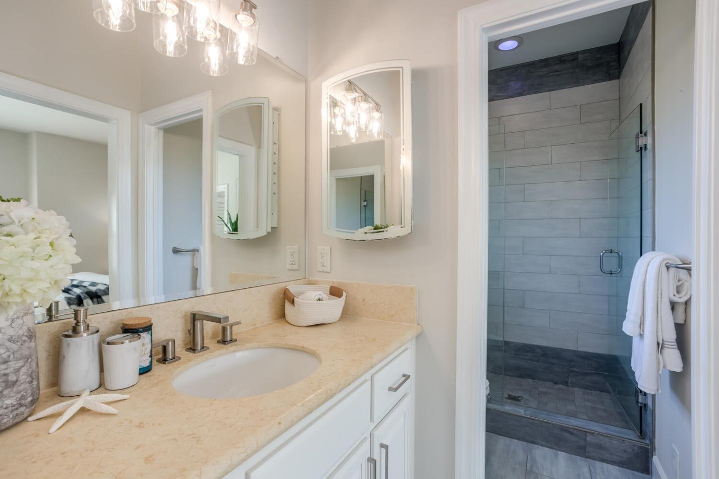 563 Alberta Avenue Sunnyvale, CA 94087 - Photo 20 of 32 a bathroom with a double vanity sink mirror and shower