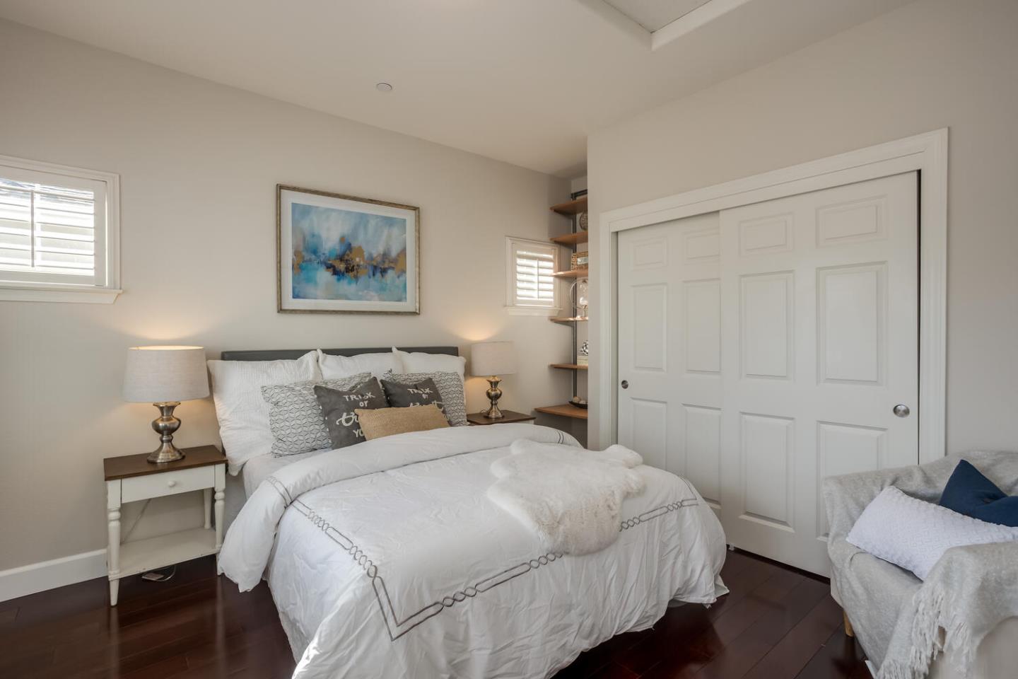 563 Alberta Avenue Sunnyvale, CA 94087 - Photo 23 of 32 a bedroom with a bed and a painting on the wall
