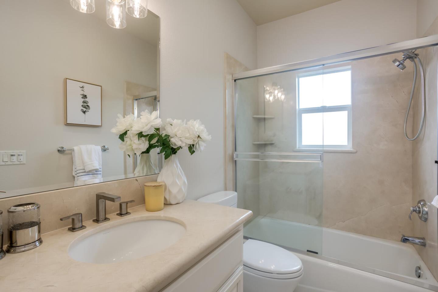 563 Alberta Avenue Sunnyvale, CA 94087 - Photo 25 of 32 a bathroom with a granite countertop sink a toilet and shower