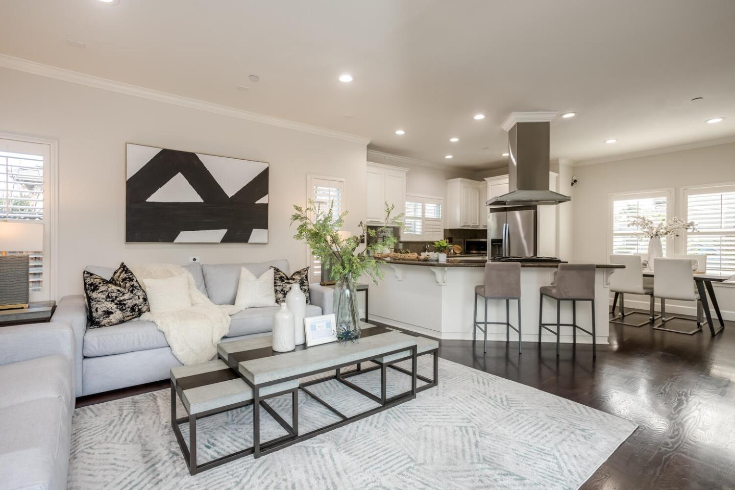 563 Alberta Avenue Sunnyvale, CA 94087 - Photo 7 of 32 a living room with furniture a wooden floor and kitchen view