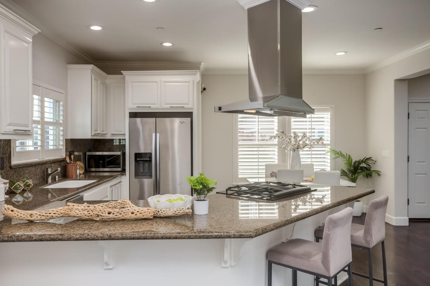 563 Alberta Avenue Sunnyvale, CA 94087 - Photo 8 of 32 a kitchen with kitchen island granite countertop a sink and a stove