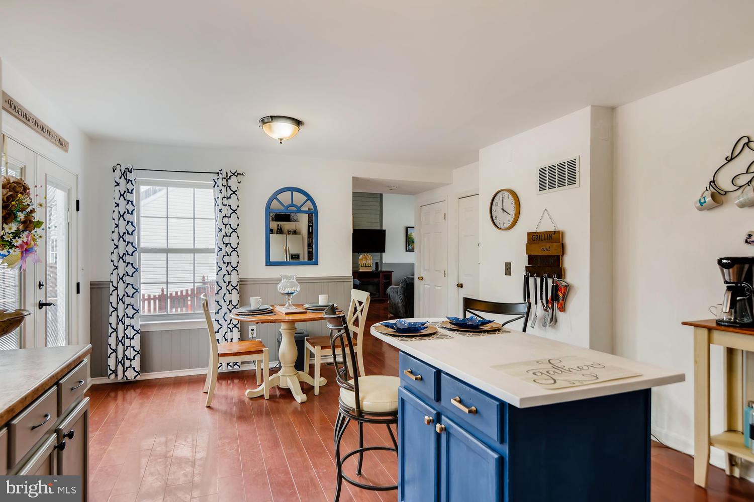 4517 Sandwood Road Baltimore, MD 21219 - Photo 8 of 27 a view of a kitchen area with furniture and wooden floor