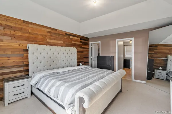 a bedroom with a bed and a walk in closet