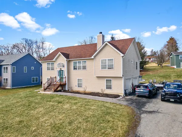 a view of a house with a yard