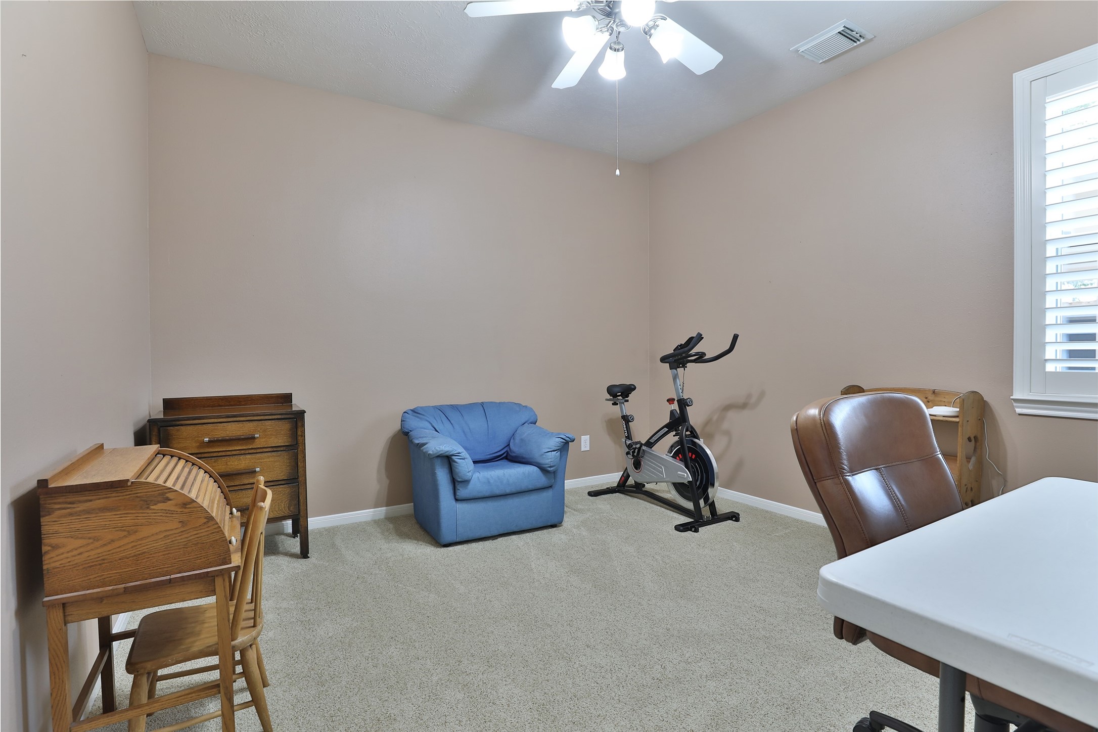 20519 Windrose Bend Drive Spring, TX 77379 - Photo 26 of 37 Secondary bedrooms two and three are situated at the rear of the home and feature access to a dedicated full bathroom.
