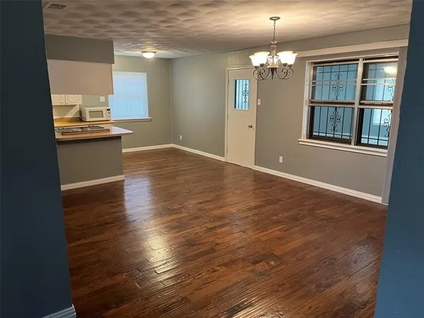 a view of a kitchen from the hallway