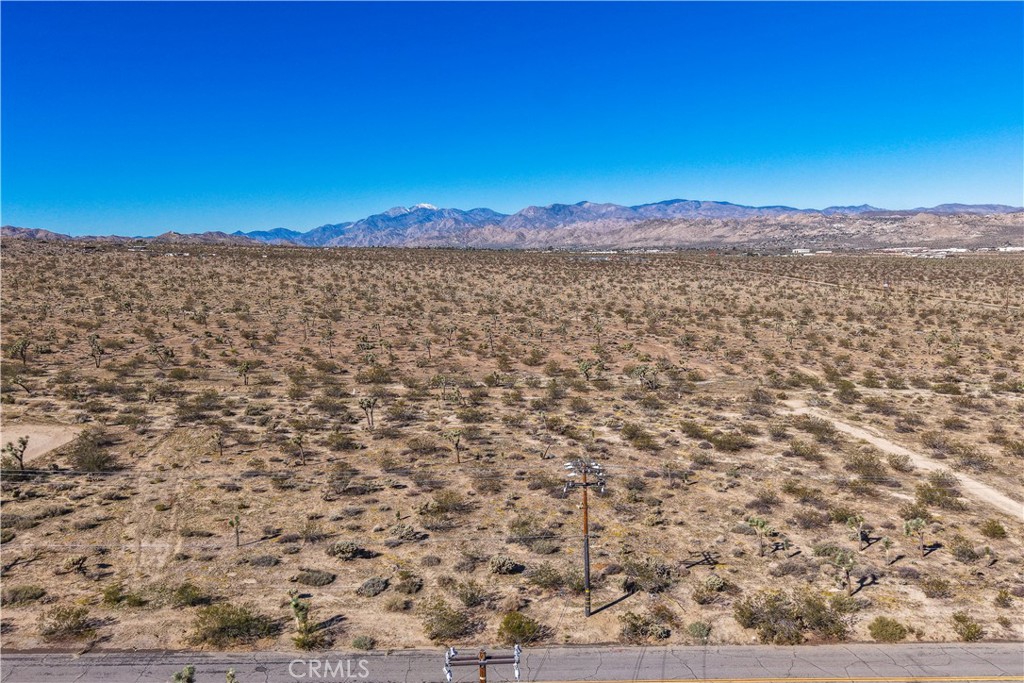 7442 Olympic Road Joshua Tree, CA 92252 - Photo 13 of 15 a view of a pathway with a yard