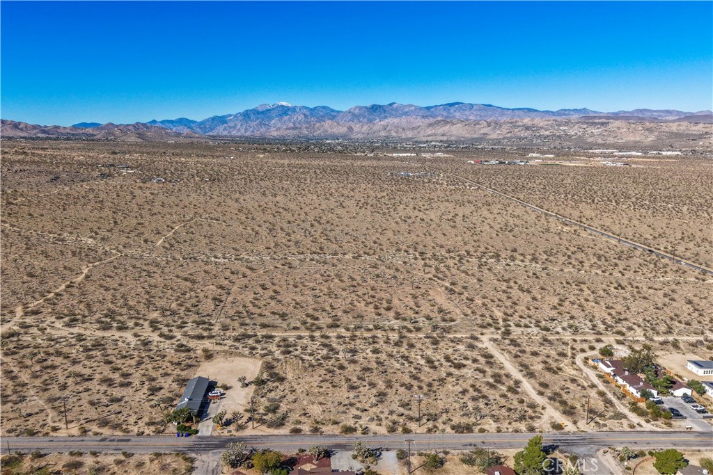 7442 Olympic Road Joshua Tree, CA 92252 - Photo 3 of 15 a view of a lake and mountain