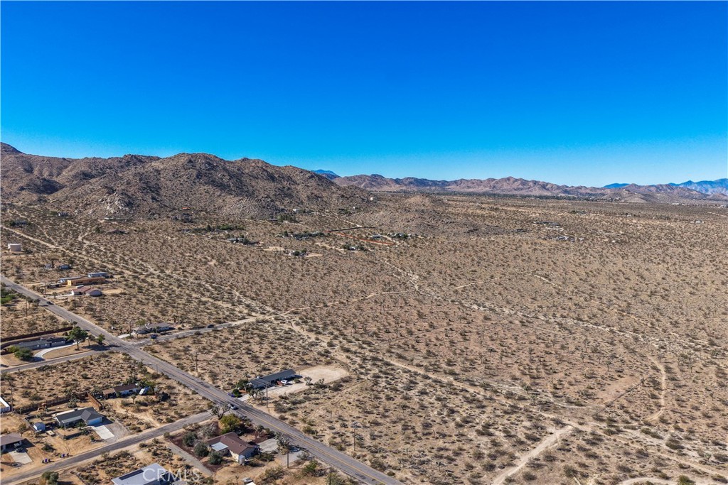 7442 Olympic Road Joshua Tree, CA 92252 - Photo 4 of 15 a view of a lake with mountains in the background