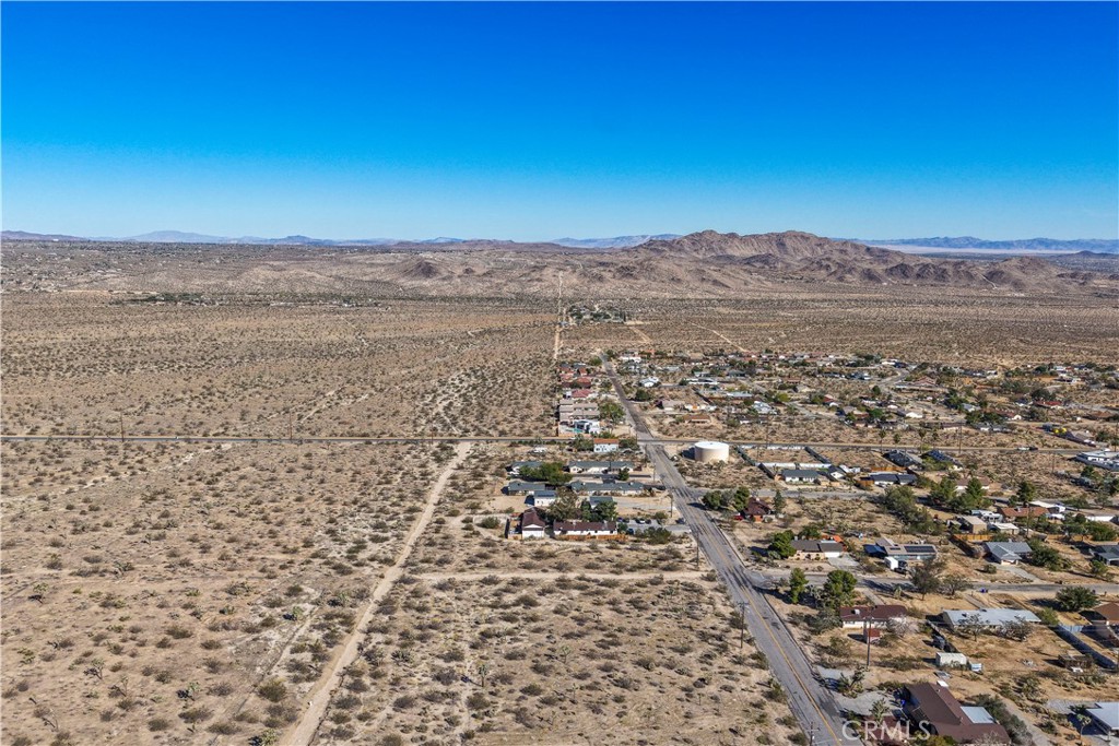 7442 Olympic Road Joshua Tree, CA 92252 - Photo 7 of 15 an aerial view of residential houses with outdoor space