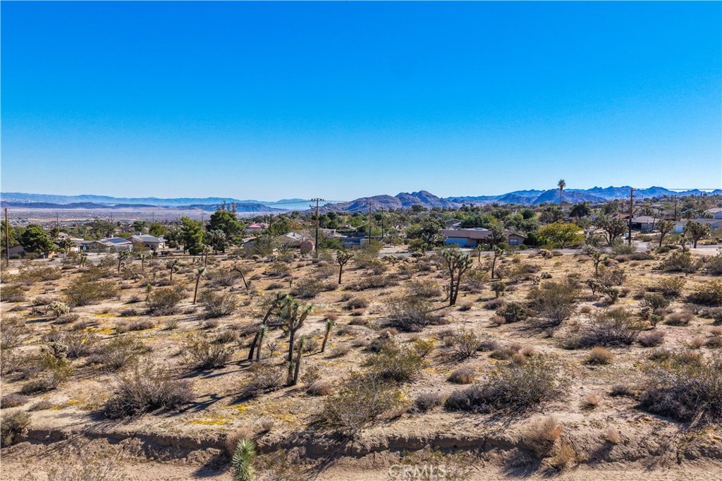 7442 Olympic Road Joshua Tree, CA 92252 - Photo 9 of 15 an aerial view of multiple house with yard