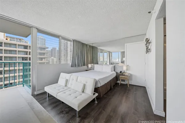 a spacious bedroom with a bed and a window