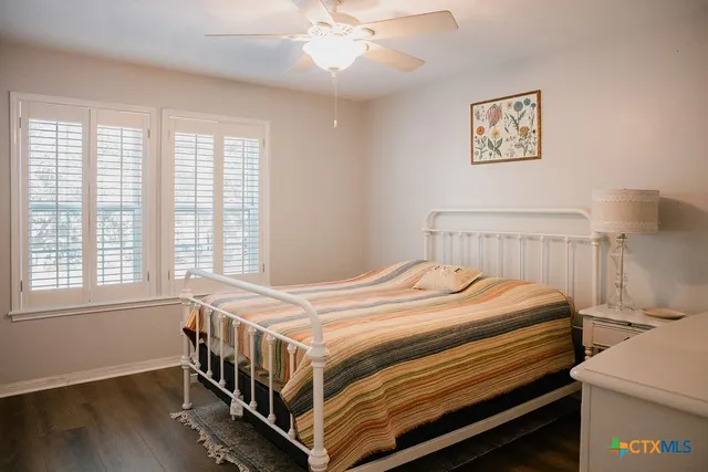 a bedroom with bed and a window