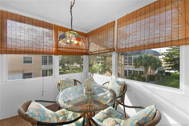 a view of a dining room with furniture window and outside view