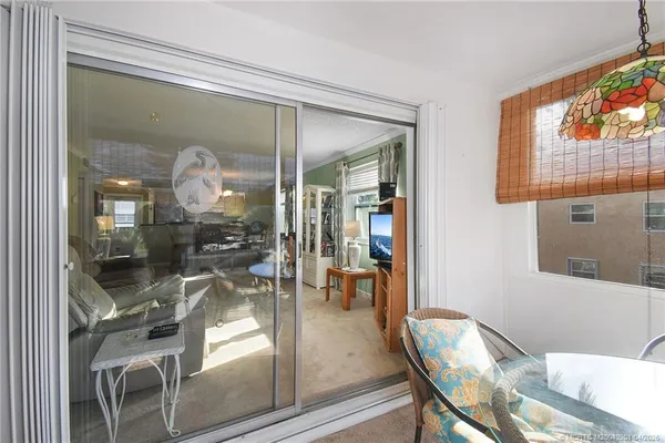 a view of a living room and dining room