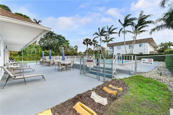 a kitchen with stainless steel appliances granite countertop a sink a stove and refrigerator