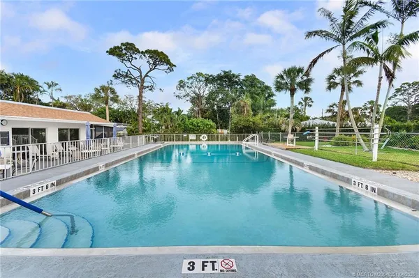 a view of a house with swimming pool