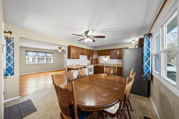 a dining room with furniture and window
