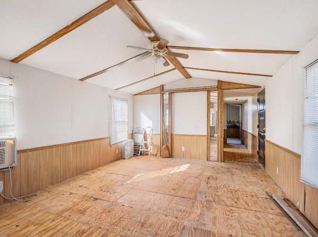 119 East Clearview Cemetery Road Bastrop, TX 78602 - Photo 11 of 22 a spacious bedroom with a bed and a large mirror