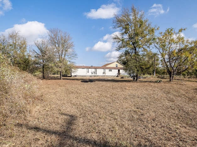 119 East Clearview Cemetery Road Bastrop, TX 78602 - Photo 7 of 22 a view of road view with large trees
