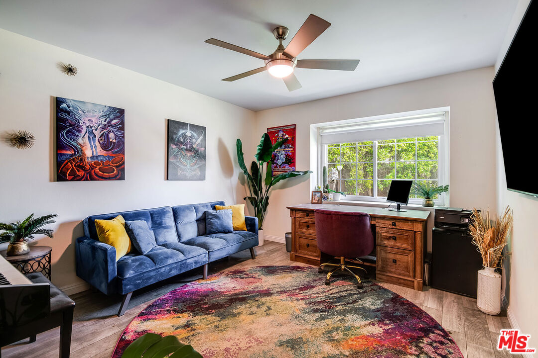 18924 Cantara Street Reseda, CA 91335 - Photo 12 of 31 a living room with furniture and a large window