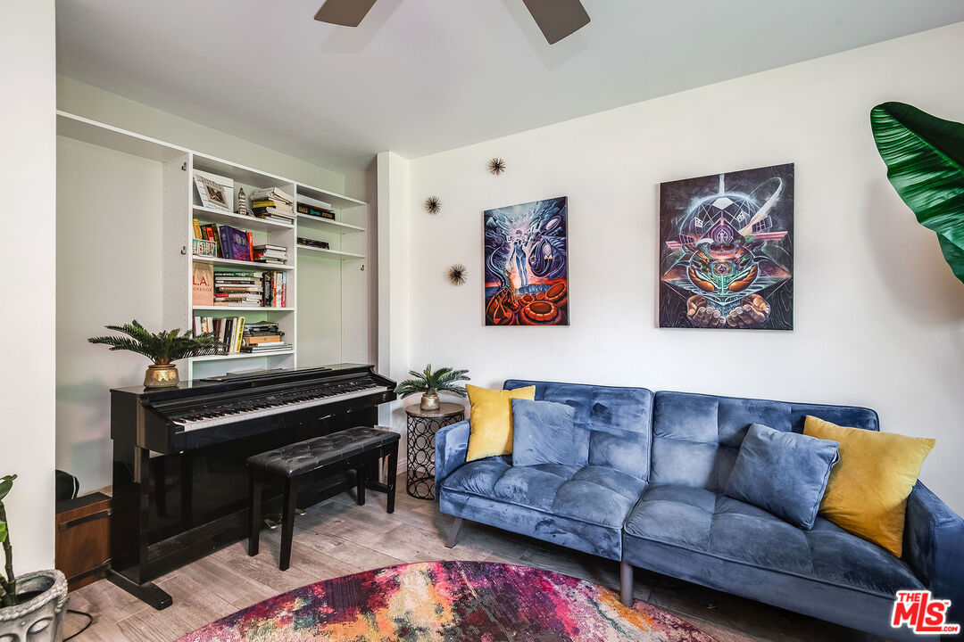 18924 Cantara Street Reseda, CA 91335 - Photo 13 of 31 a living room with furniture and a piano