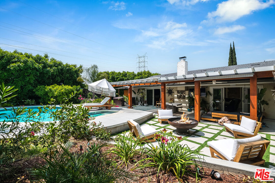 18924 Cantara Street Reseda, CA 91335 - Photo 24 of 31 a view of a patio with table and chairs and potted plants