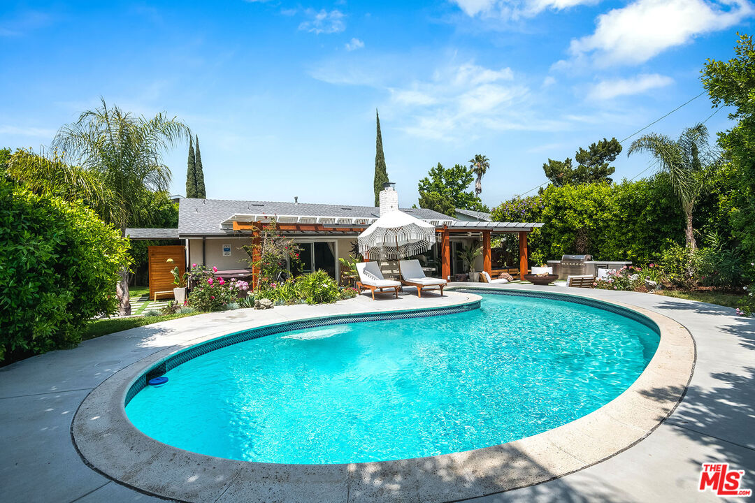 18924 Cantara Street Reseda, CA 91335 - Photo 26 of 31 a view of a swimming pool with a patio