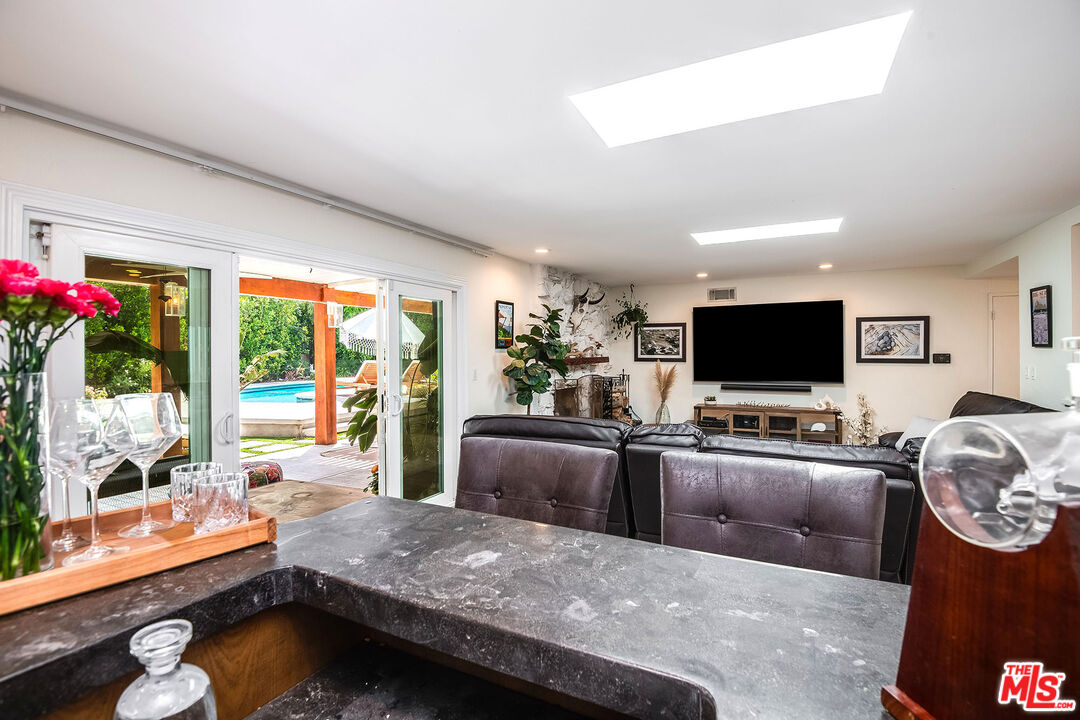18924 Cantara Street Reseda, CA 91335 - Photo 6 of 31 a living room with furniture and a flat screen tv