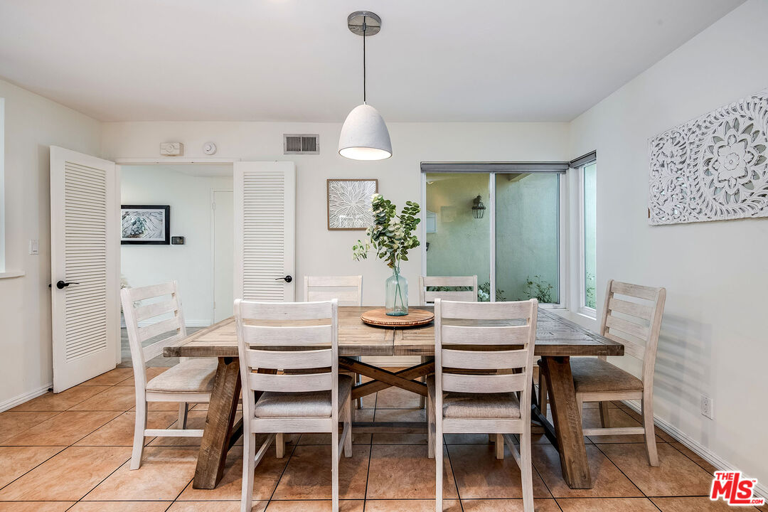 18924 Cantara Street Reseda, CA 91335 - Photo 9 of 31 a dining room with furniture and window