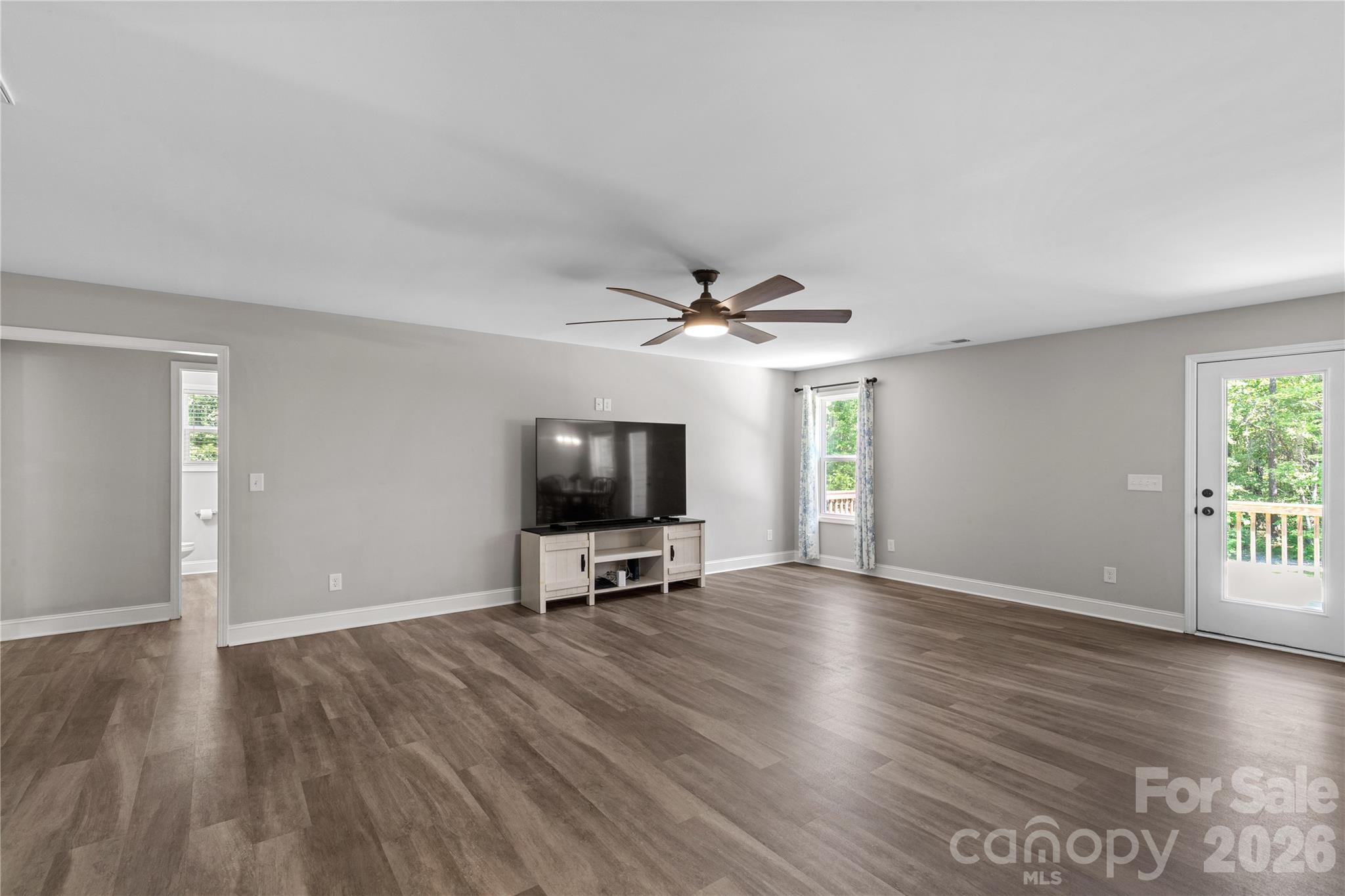 4335 Palmer Lloyd Road Lancaster, SC 29720 - Photo 12 of 33 wooden floor in an empty room with a window