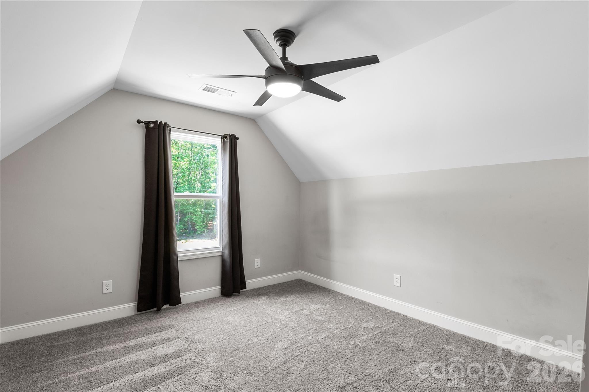 4335 Palmer Lloyd Road Lancaster, SC 29720 - Photo 25 of 33 an empty room with ceiling fan and window