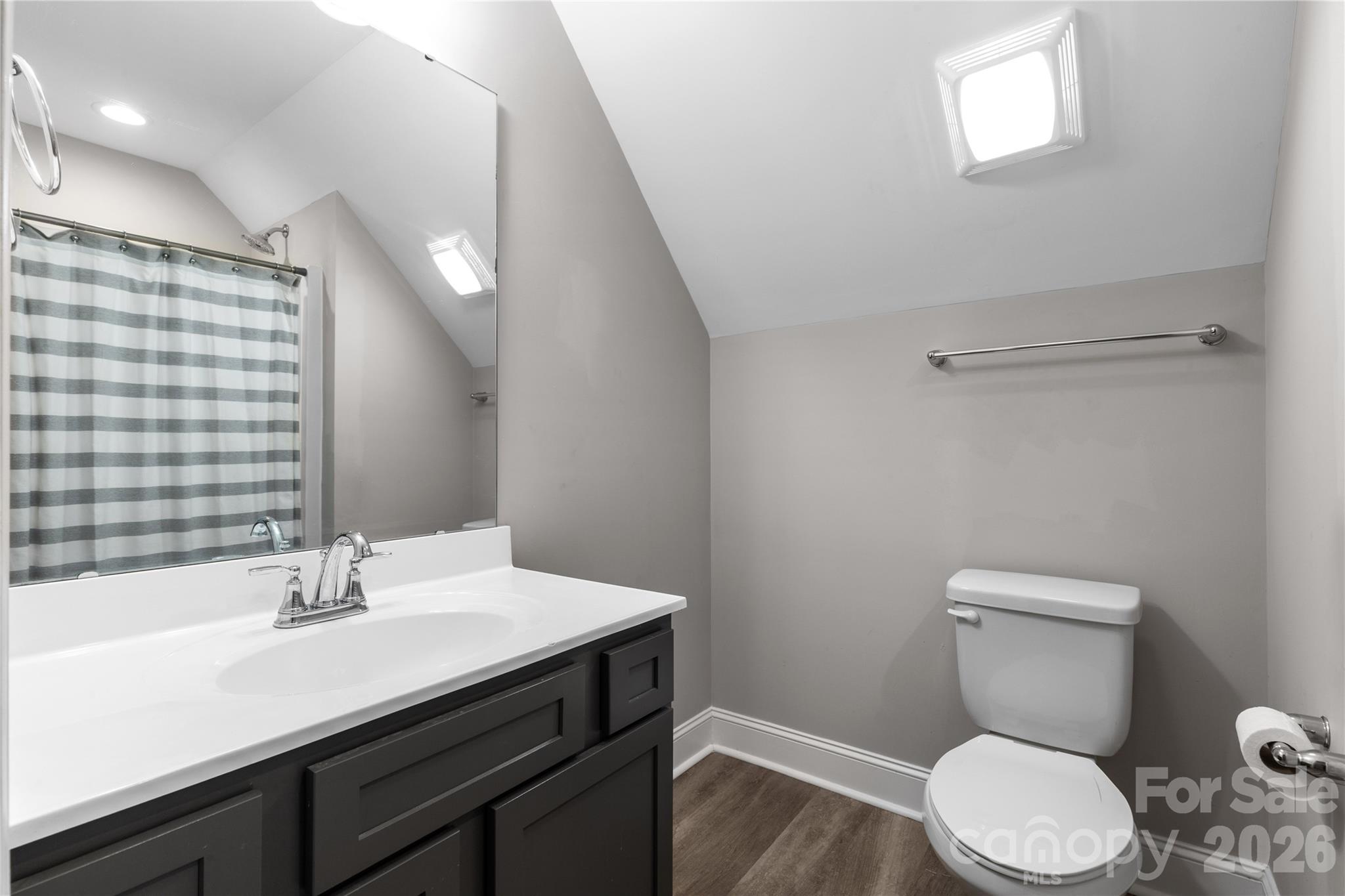 4335 Palmer Lloyd Road Lancaster, SC 29720 - Photo 26 of 33 a bathroom with a sink a toilet a mirror and shower