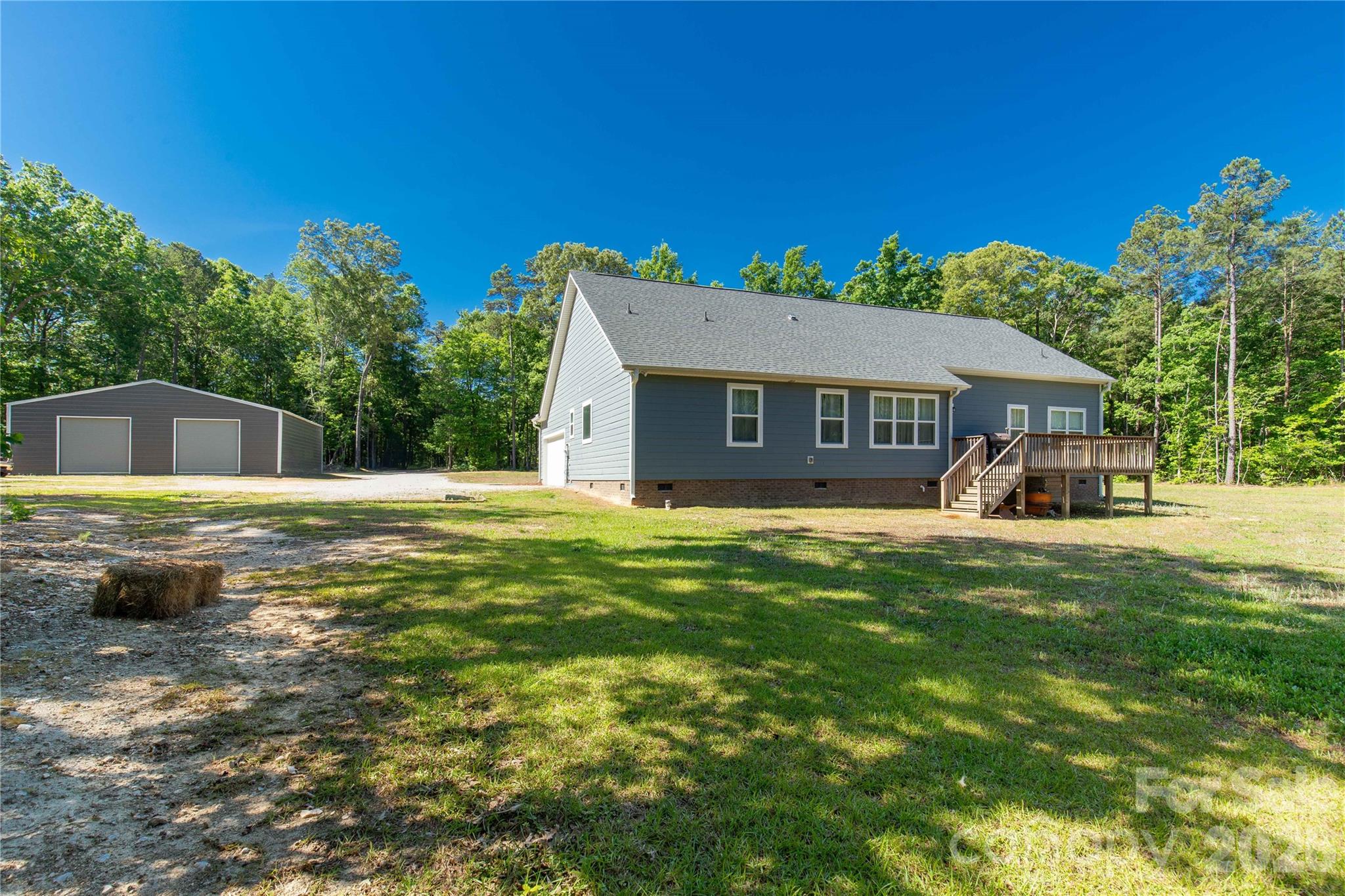 4335 Palmer Lloyd Road Lancaster, SC 29720 - Photo 28 of 33 a view of a house with a backyard porch and sitting area