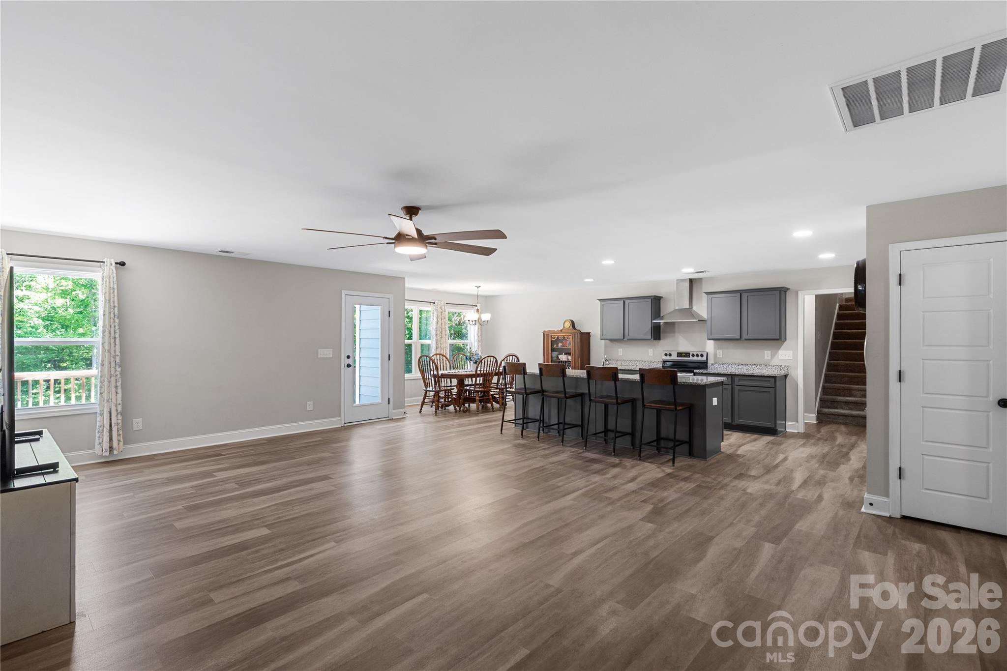4335 Palmer Lloyd Road Lancaster, SC 29720 - Photo 8 of 33 a living room with furniture and kitchen view with wooden floor