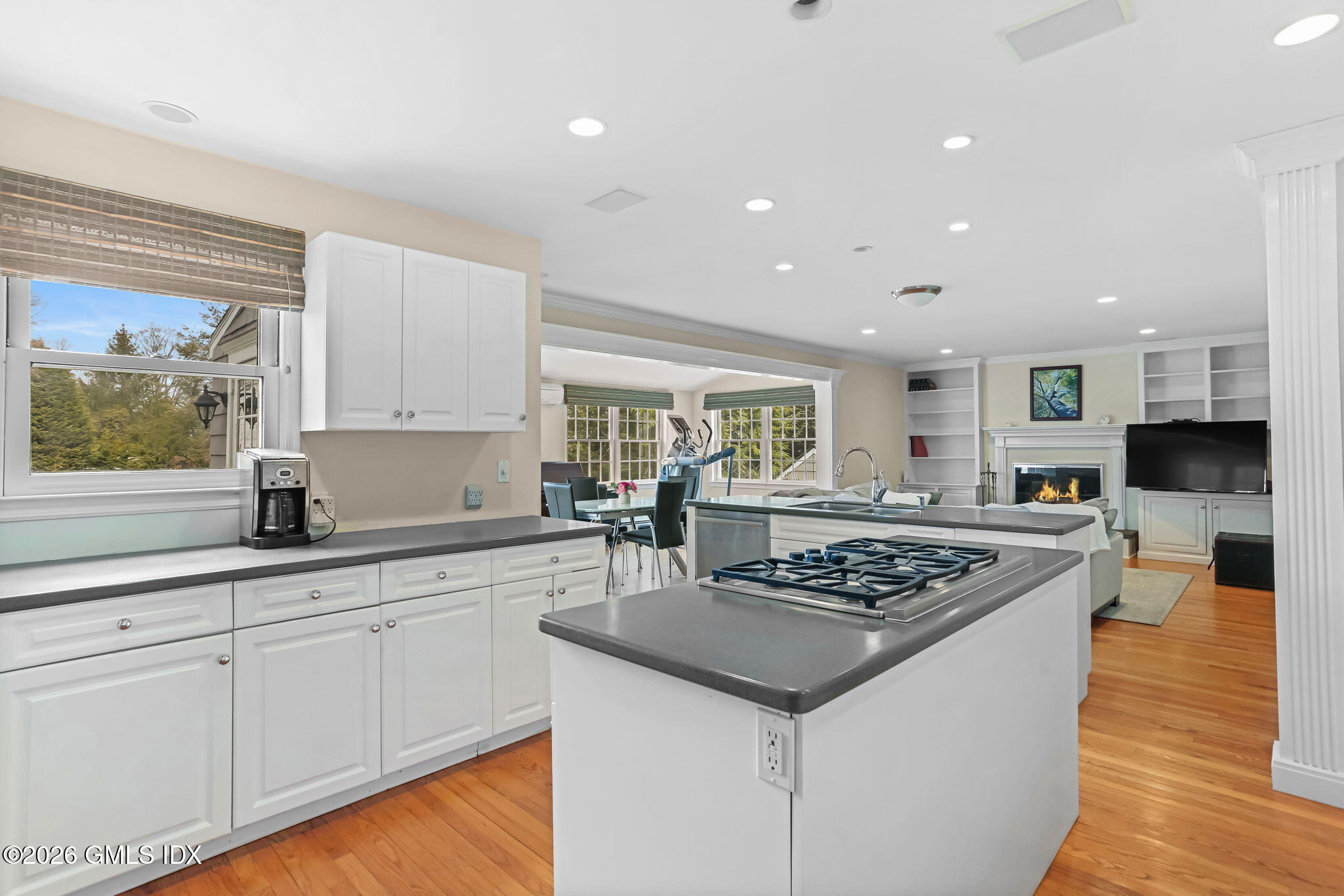 153 Lockwood Road Riverside, CT 06878 - Photo 16 of 58 a kitchen with stainless steel appliances granite countertop a stove a sink and a microwave
