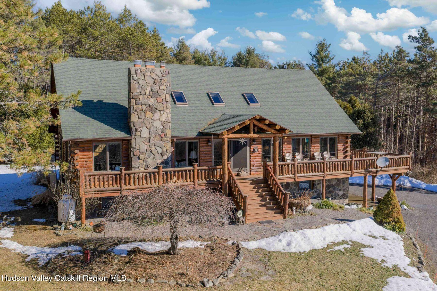 406 Cheese Hill Road Preston Hollow, NY 12469 - Photo 1 of 59 a front view of a house with a yard