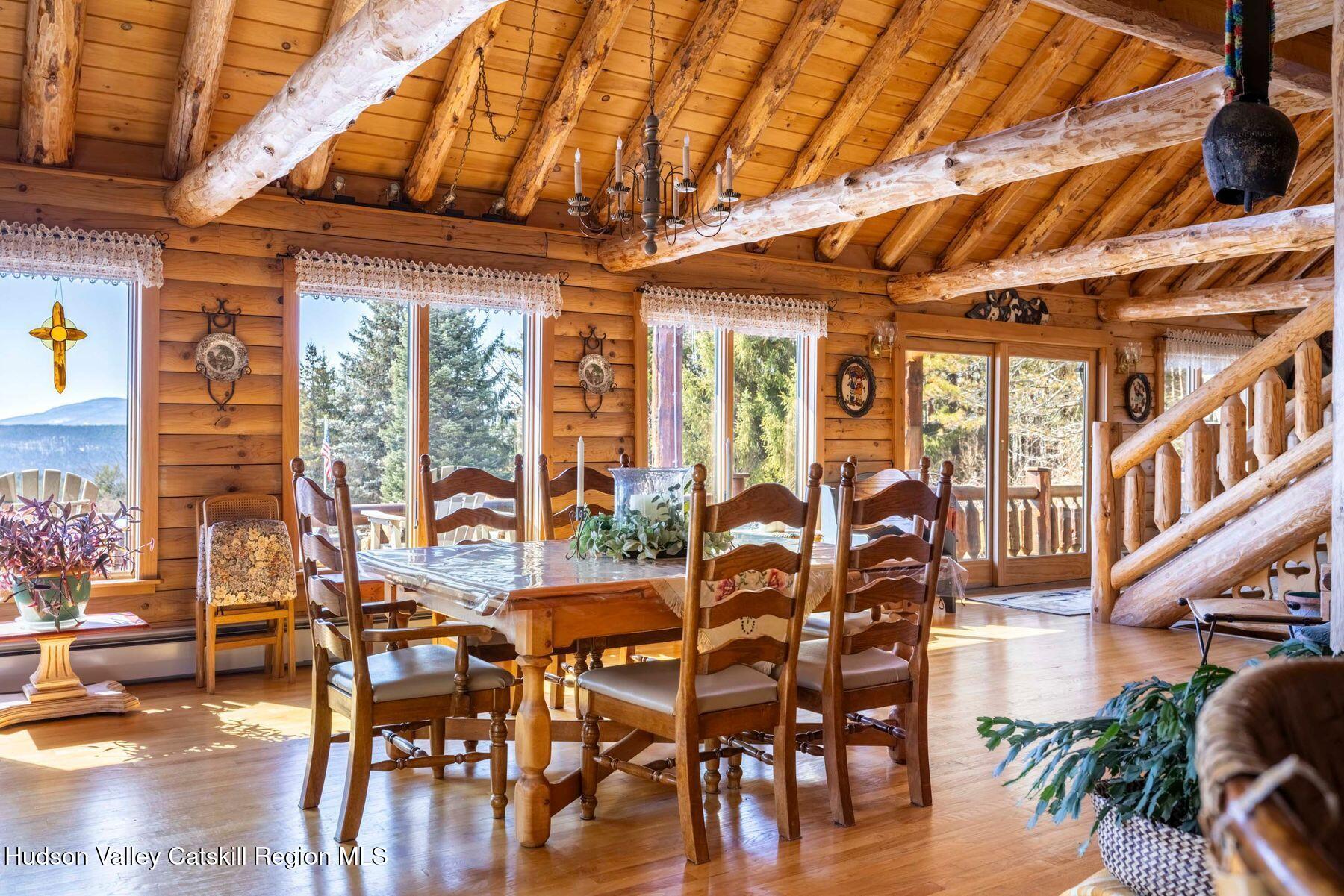 406 Cheese Hill Road Preston Hollow, NY 12469 - Photo 15 of 59 a view of a dining room with furniture window and outside view