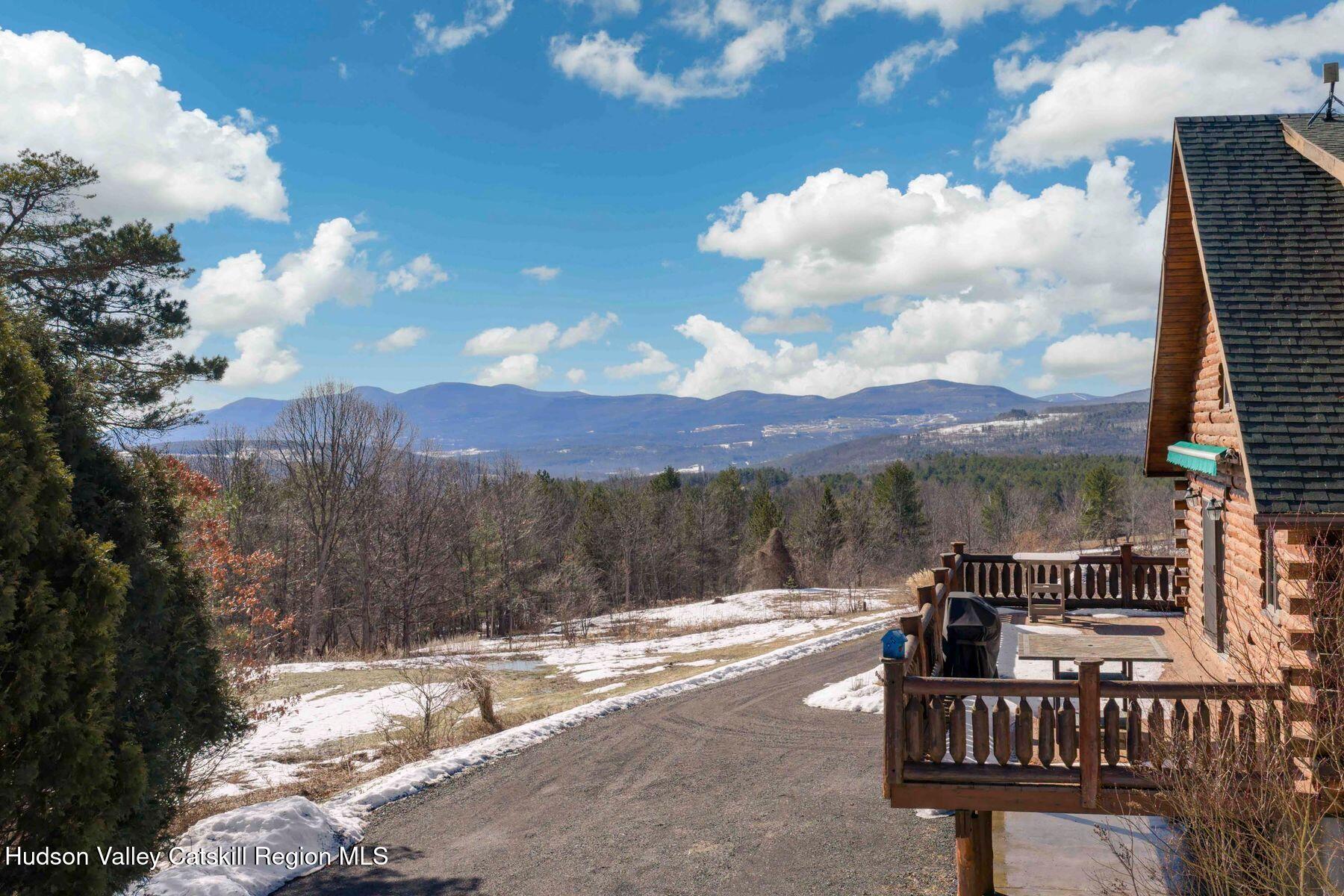 406 Cheese Hill Road Preston Hollow, NY 12469 - Photo 2 of 59 a view of a terrace with a bench