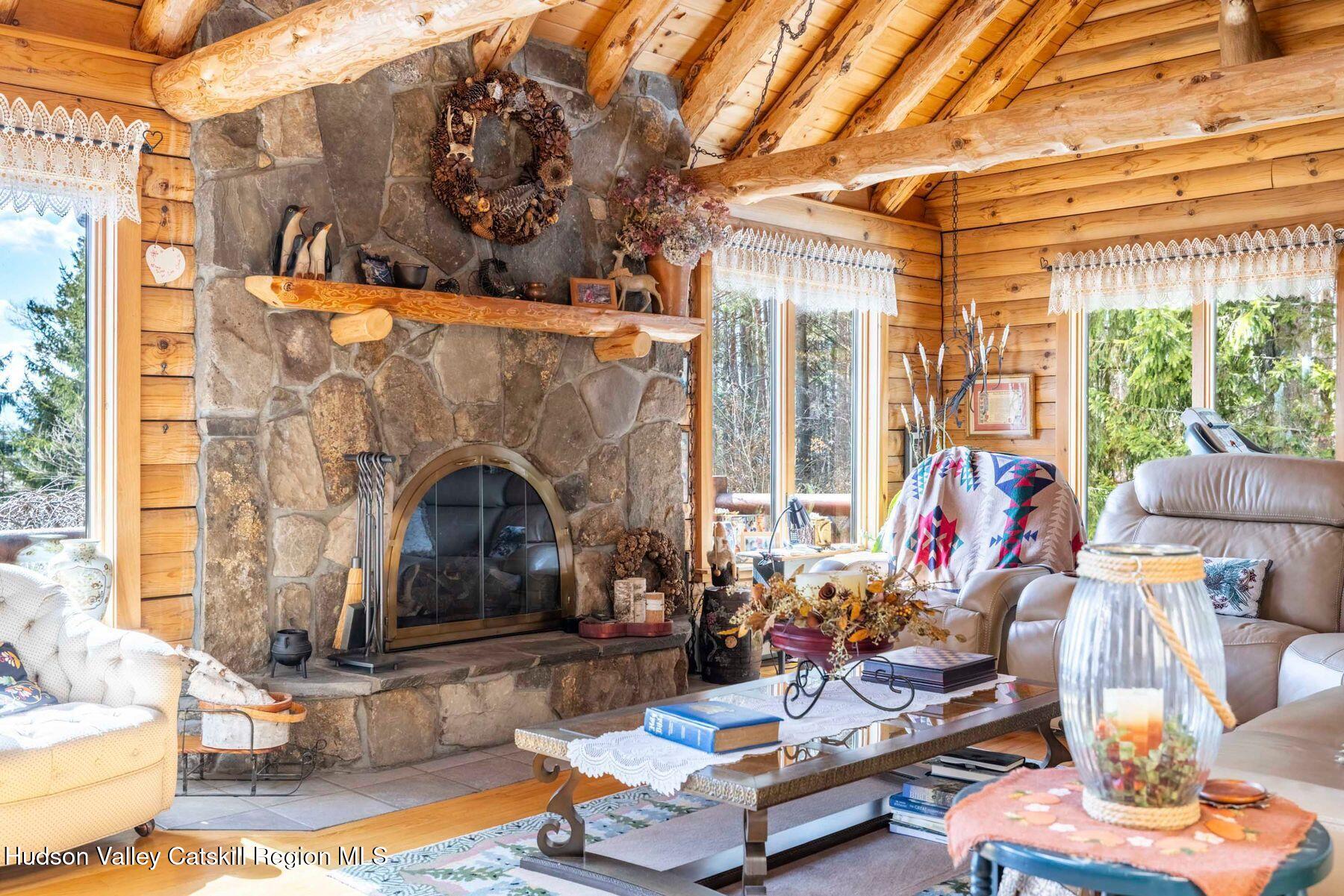 406 Cheese Hill Road Preston Hollow, NY 12469 - Photo 24 of 59 a living room with furniture and a fireplace