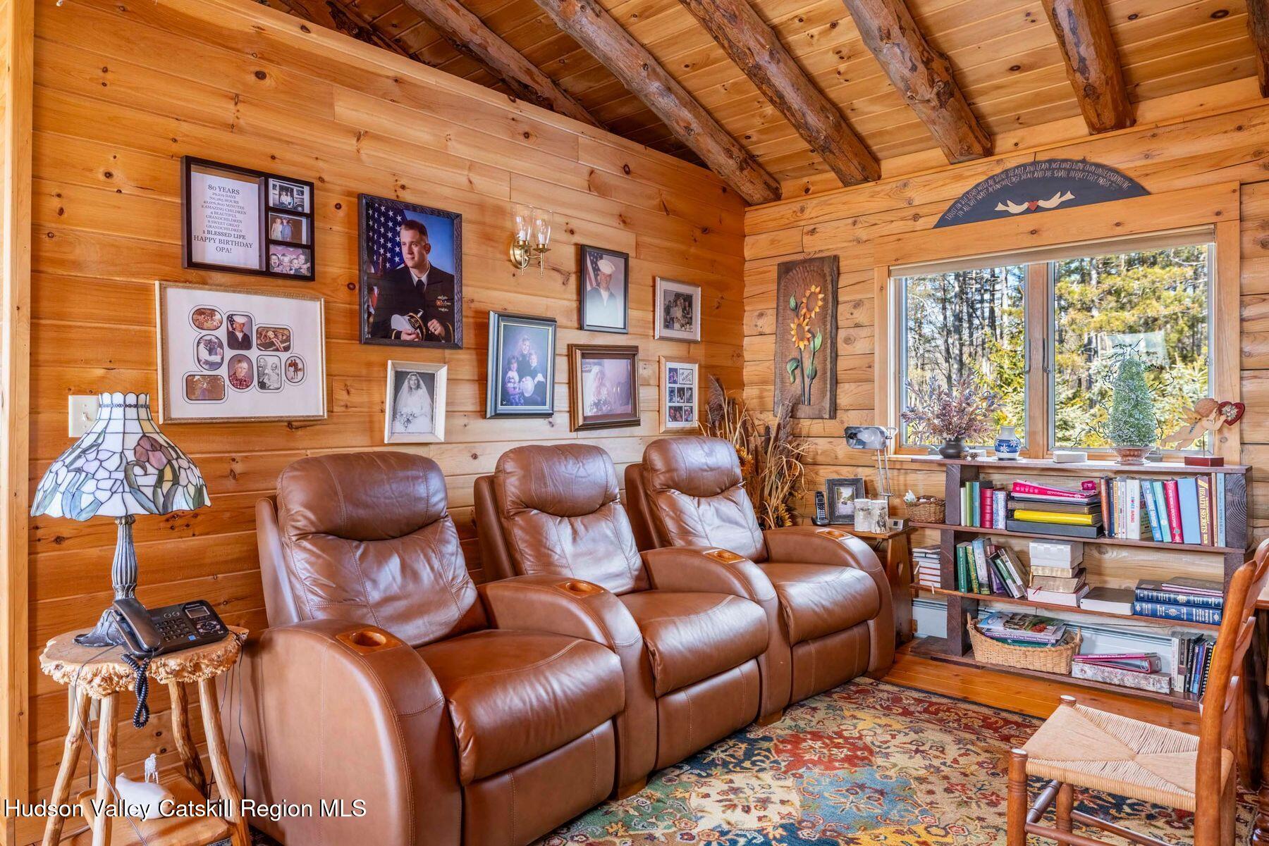 406 Cheese Hill Road Preston Hollow, NY 12469 - Photo 32 of 59 a living room with furniture and a floor to ceiling window